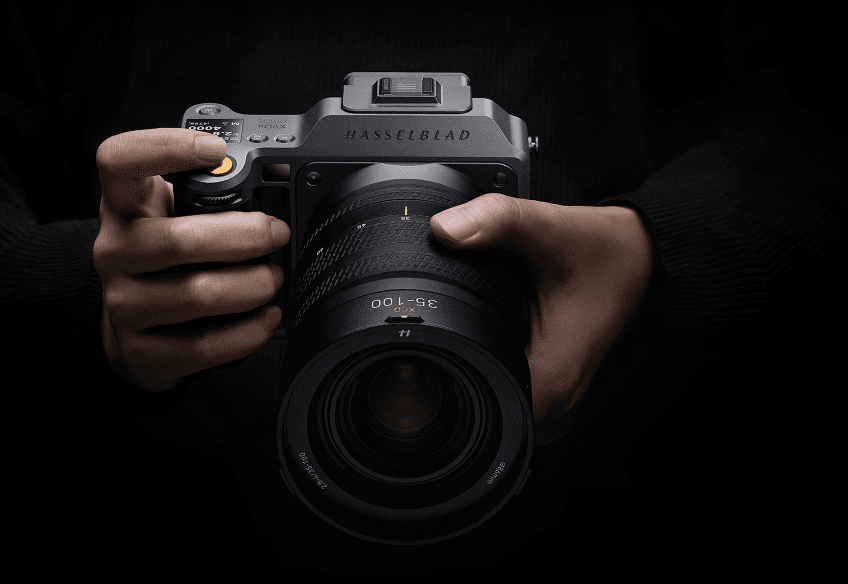 Professional camera and lens in moody lighting